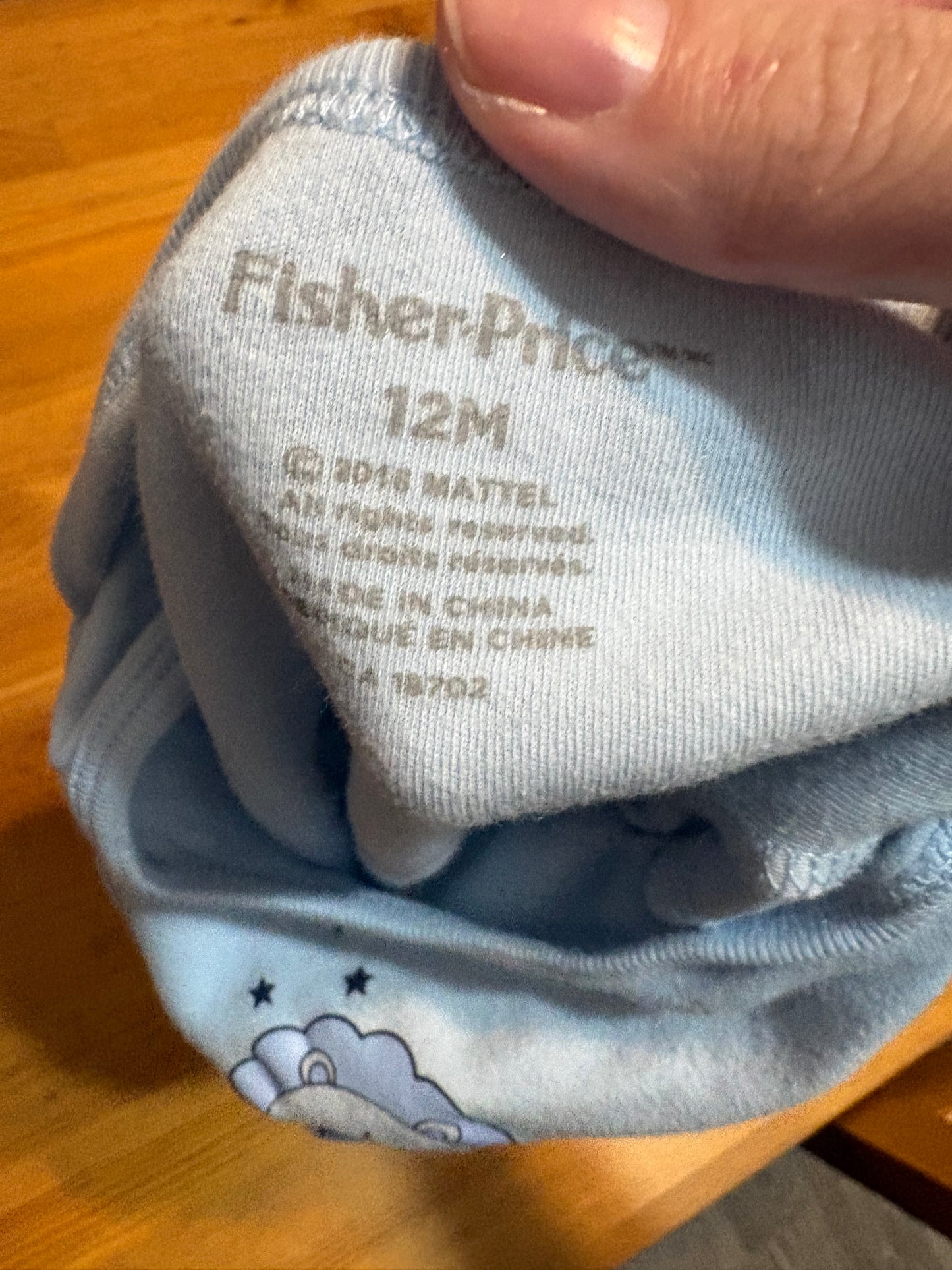 Cache-couche fisher price 12 mois